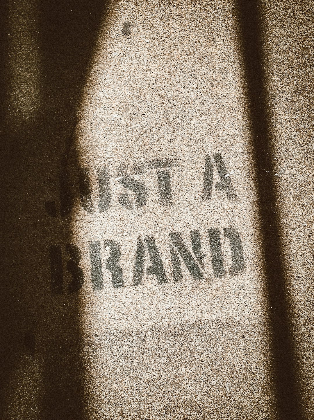 the-shadow-of-a-person-standing-in-front-of-a-sign-vhtjeojhs9c