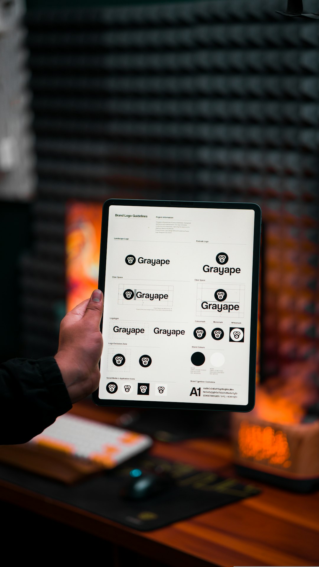 a-person-holding-up-a-tablet-with-a-bunch-of-buttons-on-it-0qpkglq5ukk